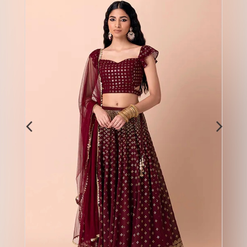 NWT - Maroon lehenga in georgette w/ four-petal gold foil motifs and gold tassel